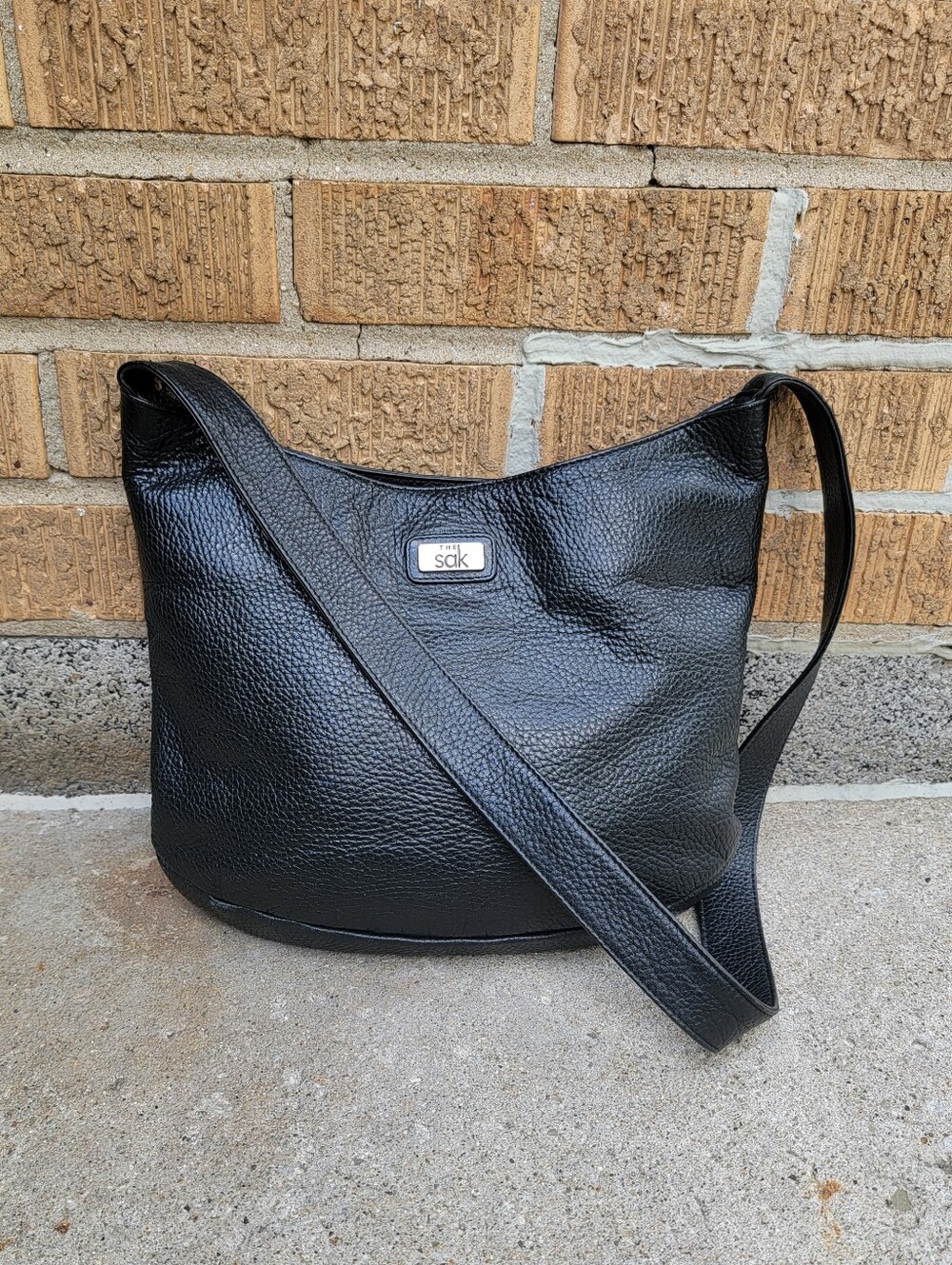The Sak Vintage Black Pebbled Leather Shoulder Bag with Silver Logo